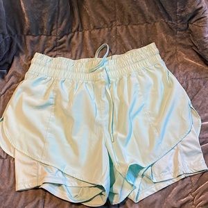 Running shorts with spandex attached. Size M color is Mint.
